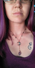 Load image into Gallery viewer, Amethyst crystal hand wrapped in copper wire hanging from wrapped crescent moon shaped abalone shell corresponding chain with stars.  
