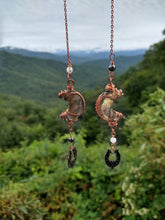 Load image into Gallery viewer, Crescent moon shaped labradorite hand wrapped in copper wire with gemstone beads and bat charm.  
